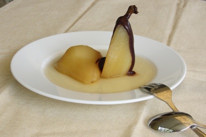 Poached pears topped with chocolate sauce